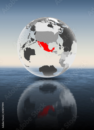 Mexico on translucent globe above water