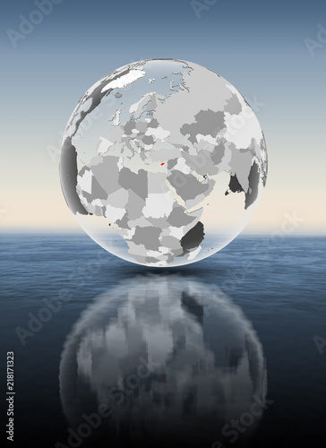 Fototapeta Naklejka Na Ścianę i Meble -  Cyprus on translucent globe above water