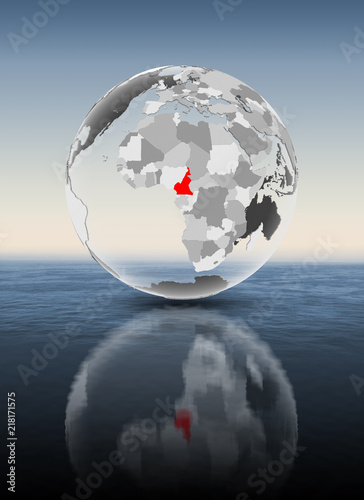 Cameroon on translucent globe above water