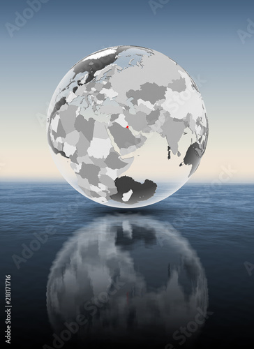 Kuwait on translucent globe above water