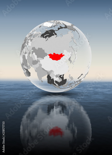 Mongolia on translucent globe above water