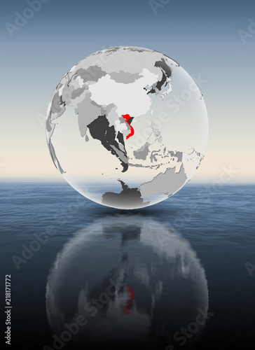 Fototapeta Naklejka Na Ścianę i Meble -  Vietnam on translucent globe above water