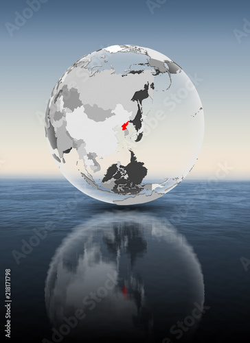 Fototapeta Naklejka Na Ścianę i Meble -  North Korea on translucent globe above water
