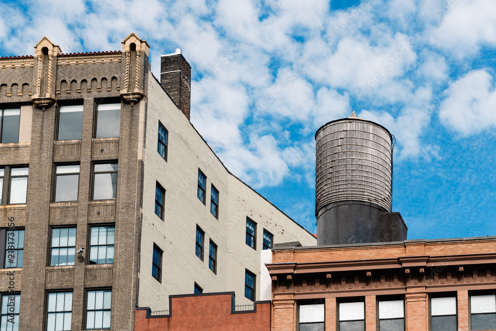 Cityscape of New York with old buildings and water tower Cityscape of New York with old buildings and water tower