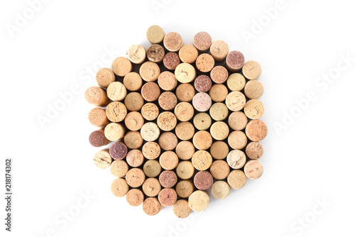 Pile of assorted used wine corks in shape of circle isolated on white background. Close up top view.