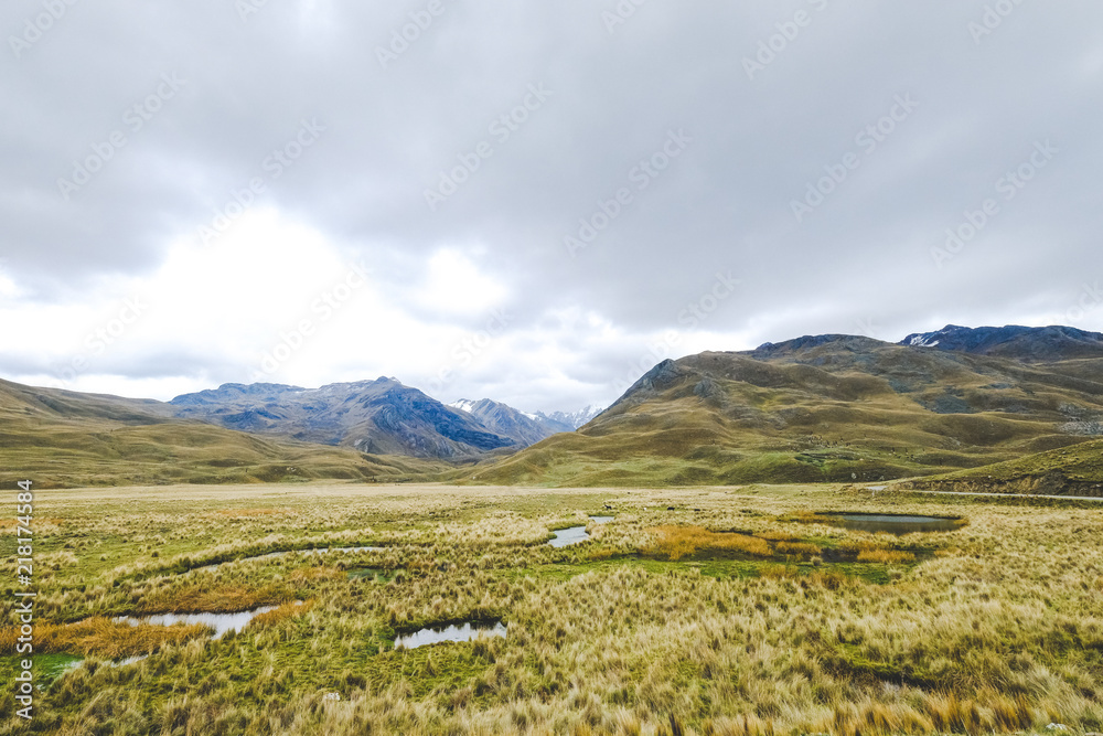 Peru. Mountain landscape in cloudy weather with steppe in the foreground
