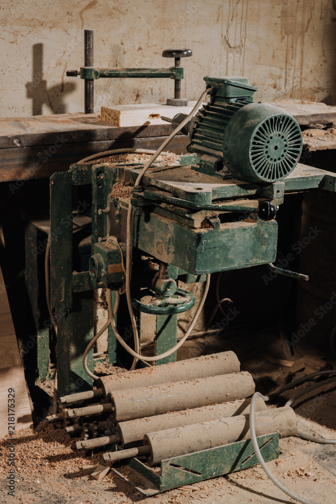 close up view of woodworkers workplace with equipment and wood at workshop