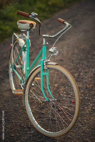 Retro bicycle on the road in sunset, detail photography of bike components