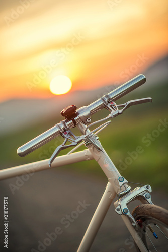 Retro bicycle on the road in sunset, detail photography of bike components