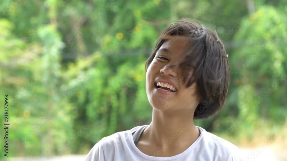 Portrait of a cute little girl smiles looking at camera, Slow motion
Portrait of a cute little girl smiles looking at camera, Slow motion