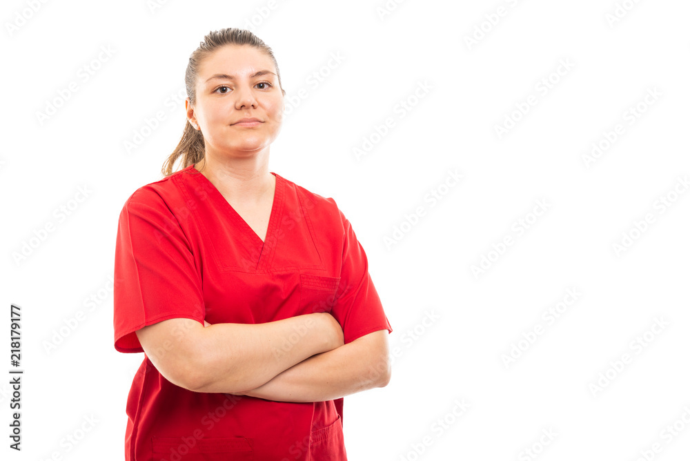 Young medical nurse wearing red scrub standing with arms crossed. Young medical nurse wearing red scrub standing with arms crossed.