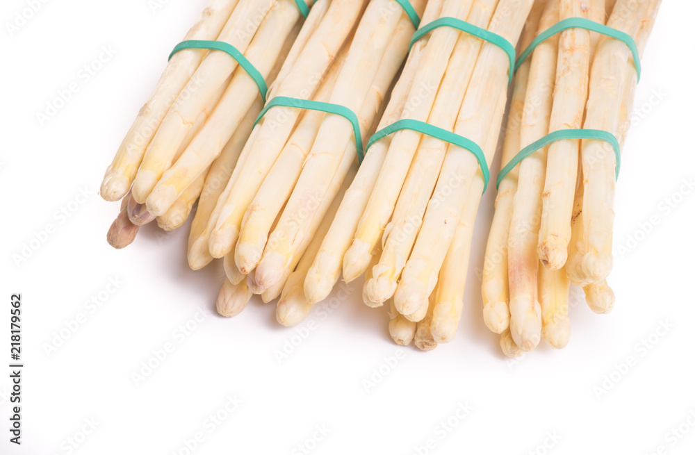 bundle of organic asparagus held together with green elastics rubber bands