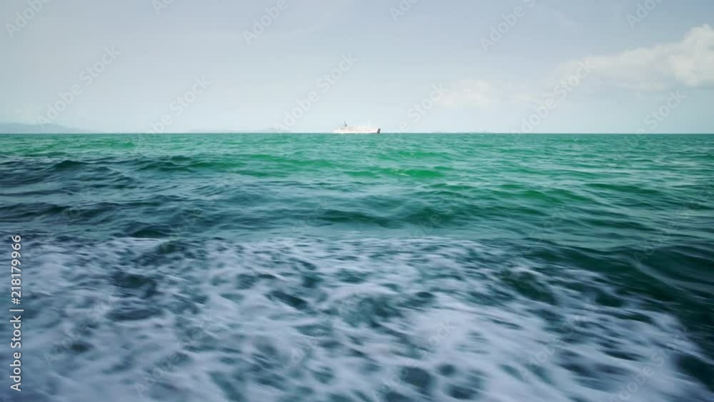 View of the waves in the sea from a ferry boat sailing on a sunny summer day. 4k View of the waves in the sea from a ferry boat sailing on a sunny summer day. 4k