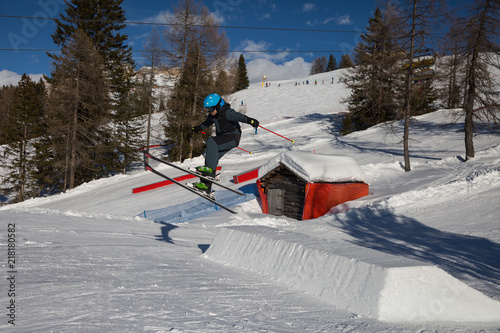 Skier in Action: Ski Jumping in the Mountain Snowpark