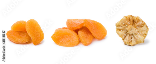 handfuls of dried apricots and pineapple isolated on white background