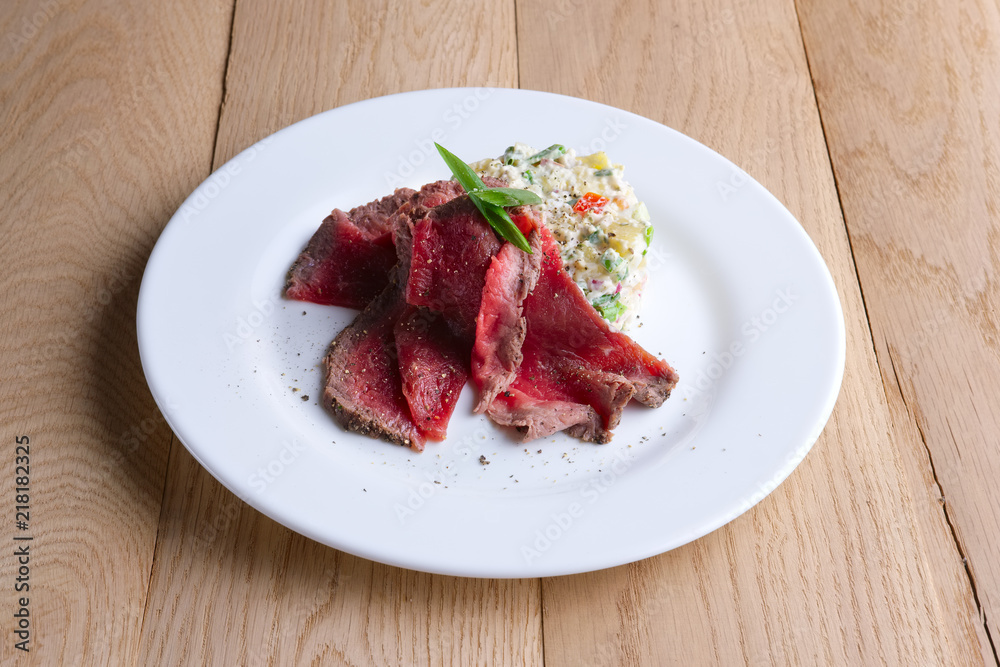 Roasted meat with salad olivier Roasted meat with salad olivier
