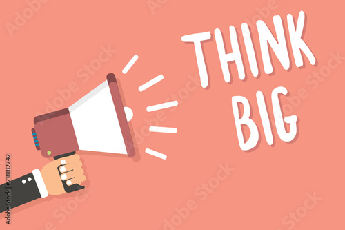 Text sign showing Think Big. Conceptual photo To plan for something high value for ones self or for preparation Man holding megaphone loudspeaker pink background message speaking loud. photo