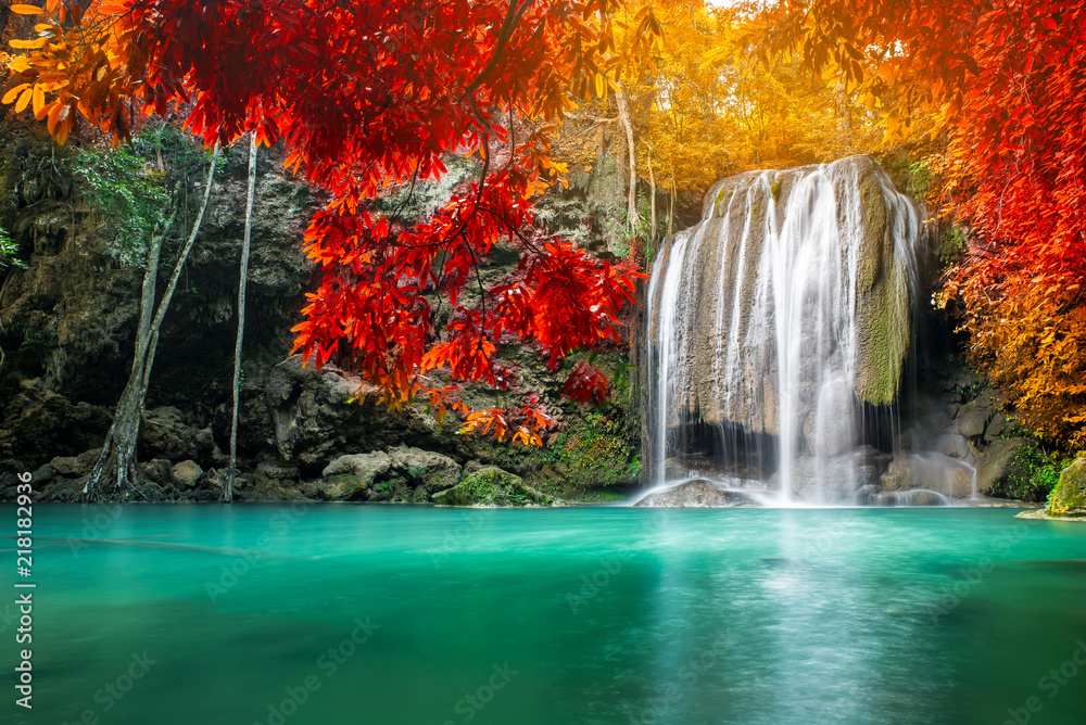 Fototapeta Amazing beauty of nature, waterfall at colorful autumn forest 