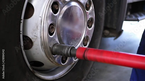 Replacement car wheels for old-car. Scene. Replacing the wheels of the car in the showroom