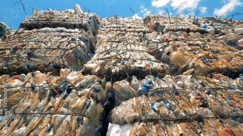 Plastic bottles and polyethylene packed into litter blocks for further recycling. photo