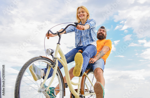 Bike rental or bike hire for short periods of time. Couple with bicycle romantic date sky background. Couple in love date cycling. Explore city. Man and woman rent bike to discover city as tourist