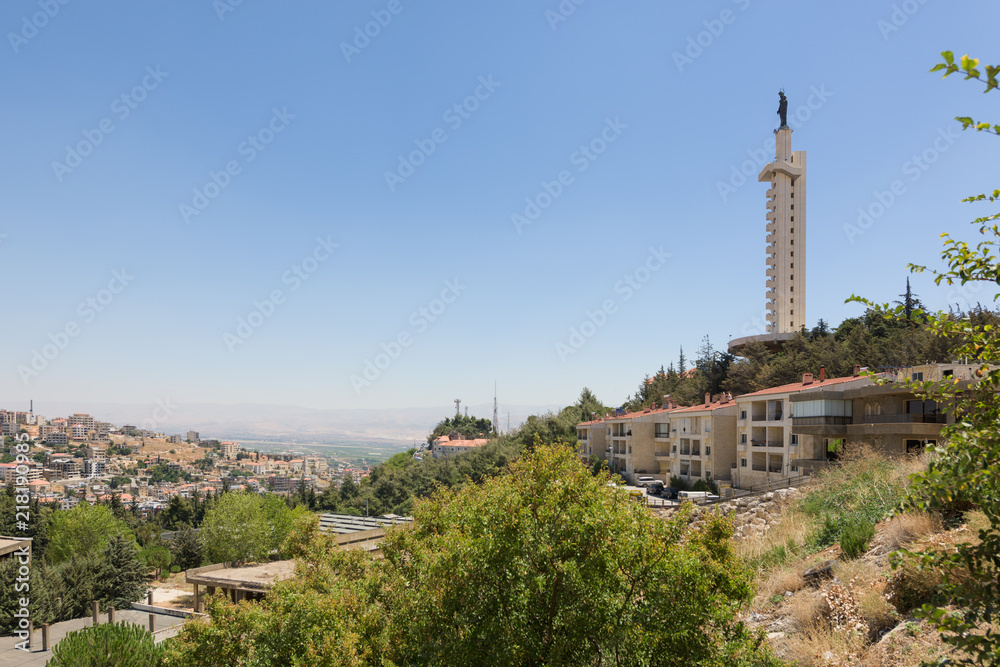 Panorama  of the Bekaa Valley in Lebanon, with Our Lady of the Bekaa church and statue over the town of Zahlé.