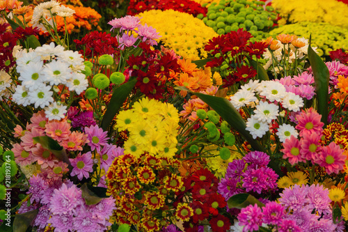 Various Colorful flowers are sale in a flower shop on a market