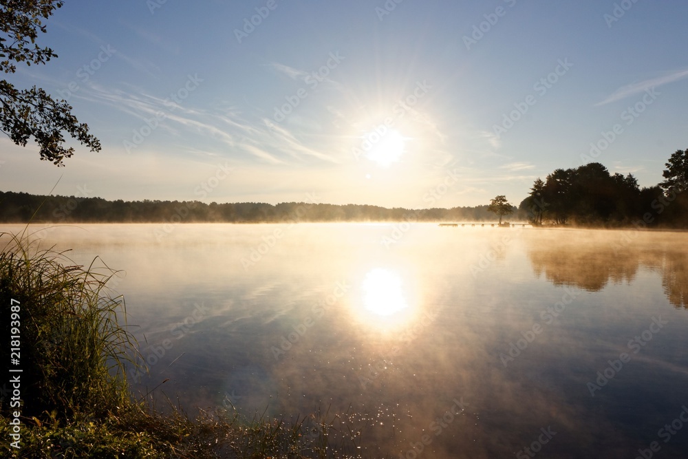 Lake during foggy sunrise Lake during foggy sunrise
