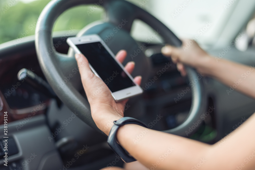 women driver with a cell phone