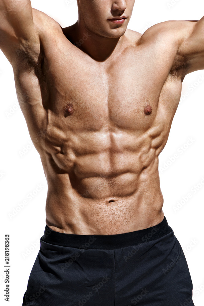 Close up of man showing muscular body and six pack abs. Photo of man  shirtless on white background. Strength and motivation Stock Photo
