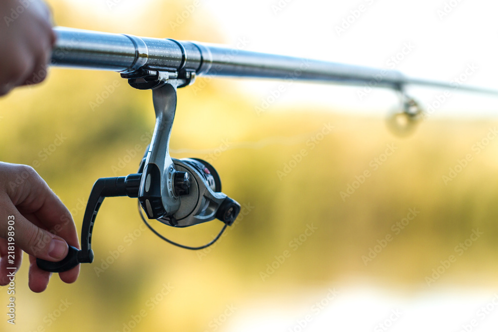 Fishing rod close-up. Fishing on the lake. Fishing tackle Stock Photo