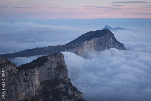 A sea of clouds in the mountains at dawn. Vercors, France.