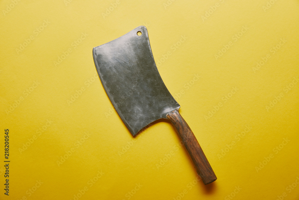 Sharp knife cleaver on yellow background