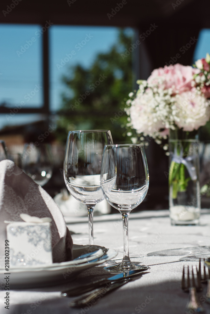 Empty glasses set in restaurant. Celebrating a wedding or other holiday Empty glasses set in restaurant. Celebrating a wedding or other holiday