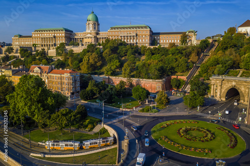 Budapest, Hungary - Clark Adam square roundabout from above at sunrise with Buda Castle Royal Palace and Tunnel and traditional yellow tram photo