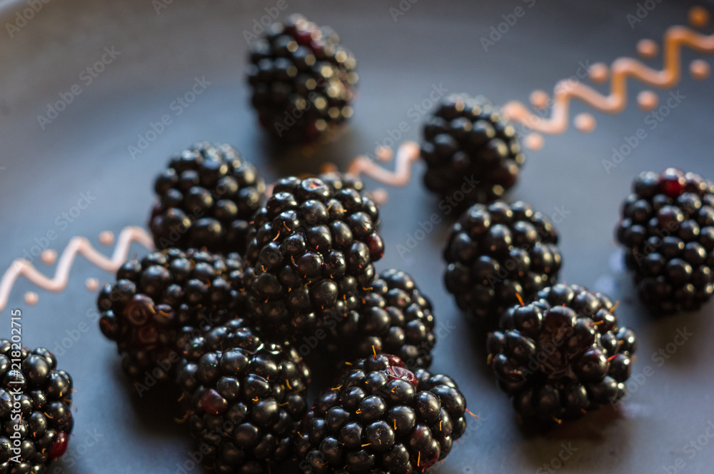 large juicy blackberry berries on a ceramic plate large juicy blackberry berries on a ceramic plate