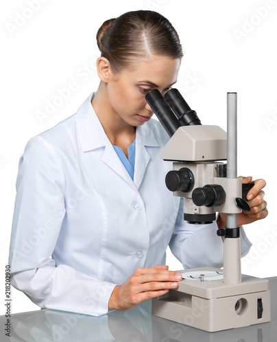 Young Female Scientist Working with Microscope on white