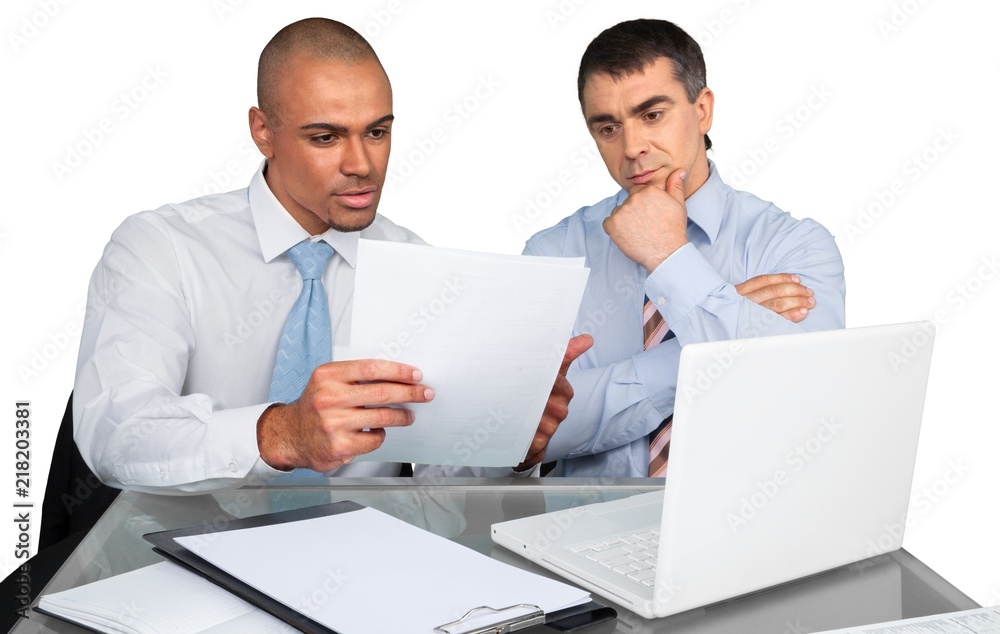 Business people making report with laptop isolated on white