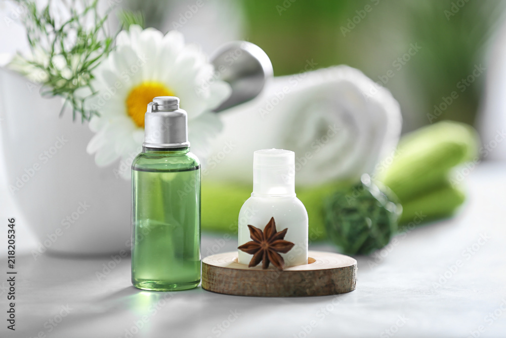 Natural cosmetics with chamomile extract on table Natural cosmetics with chamomile extract on table