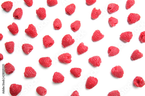 Fresh ripe raspberries on white background