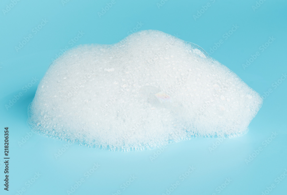 Soap foam bubble isolated on blue background object beatuy health care concept - obrazy, fototapety, plakaty 