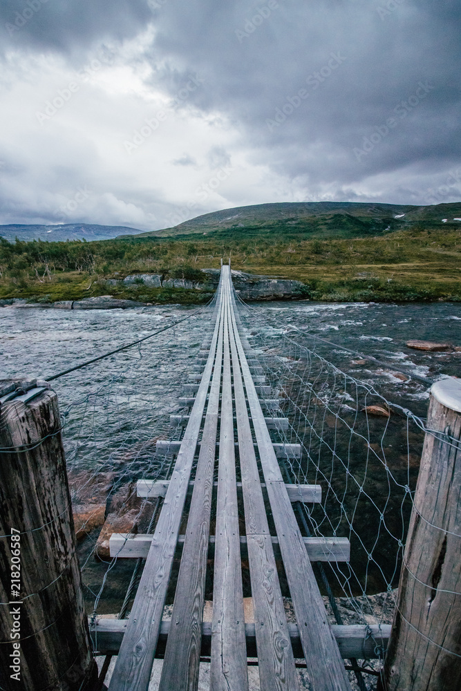 bridge over a wild river in Norway  - wanderlust