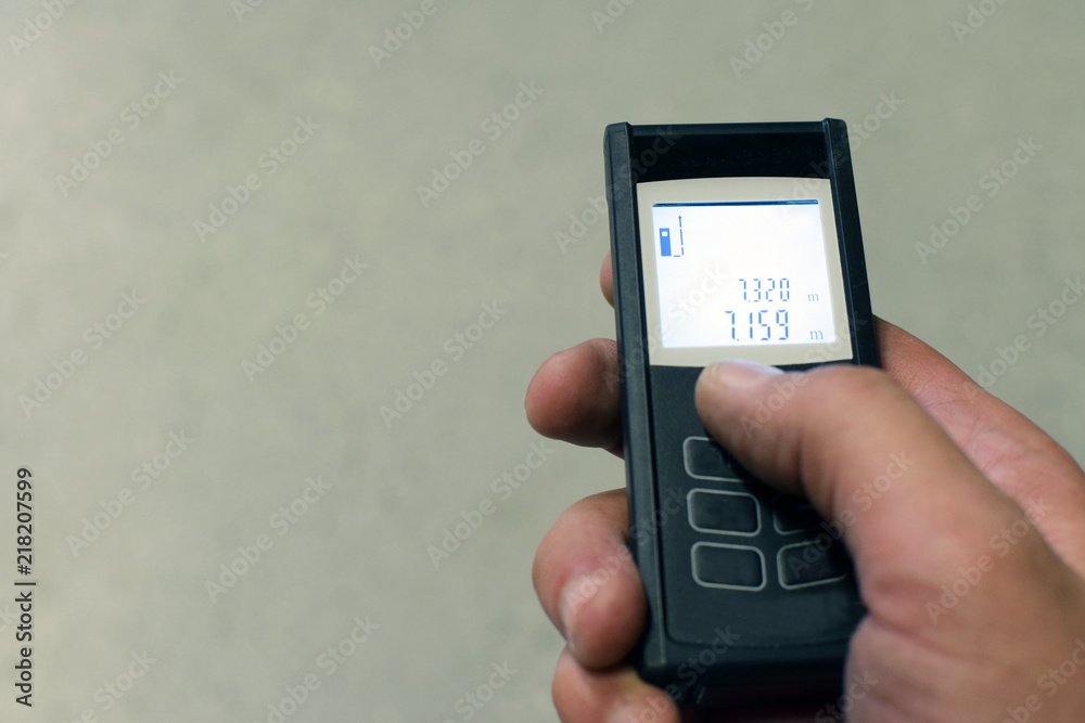 Distance meter in hand. Space for text. Distance meter in hand. Space for text.