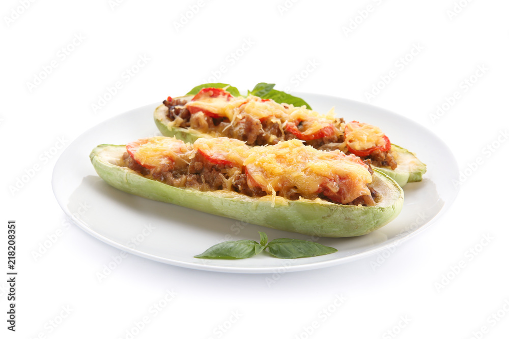 Plate with meat stuffed zucchini boats on white background Plate with meat stuffed zucchini boats on white background