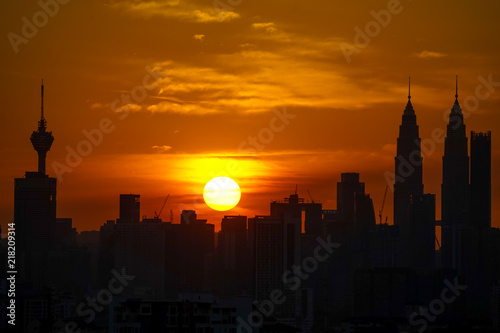 Majestic sunset over Twin Towers and surrounded buildings in downtown Kuala Lumpur  Malaysia. 