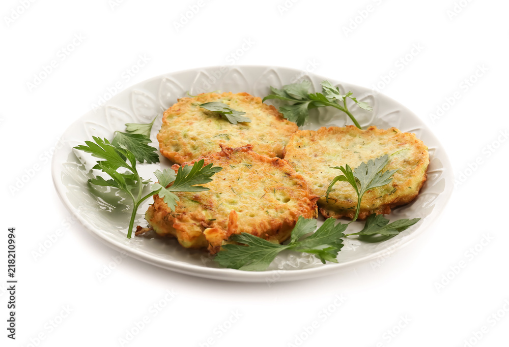 Plate with zucchini pancakes isolated on white Plate with zucchini pancakes isolated on white