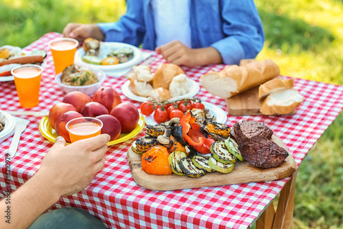 Family having picnic on summer day