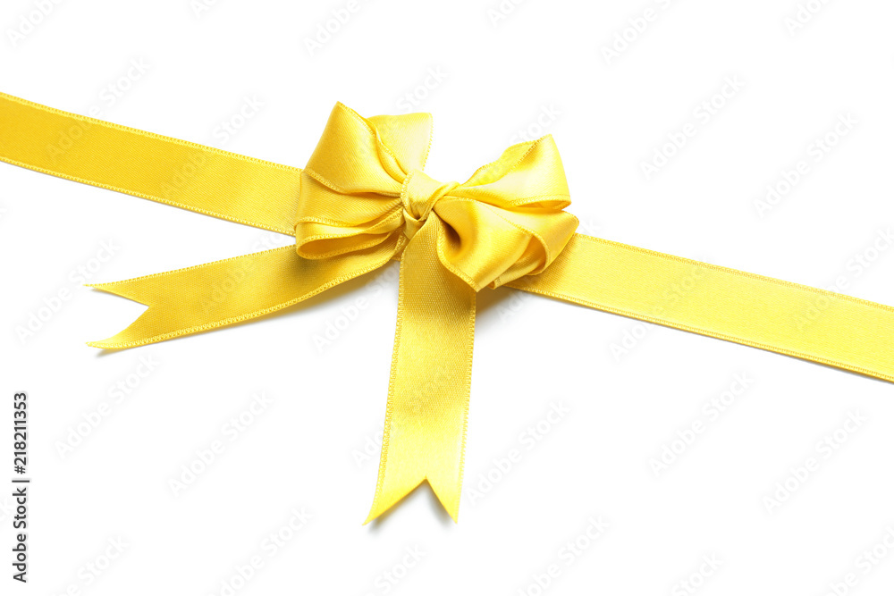 Yellow satin ribbon with bow on white background Yellow satin ribbon with bow on white background