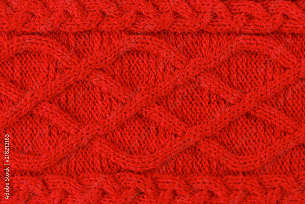 Red color cotton knitted textile with pattern as background Red color cotton knitted textile with pattern as background