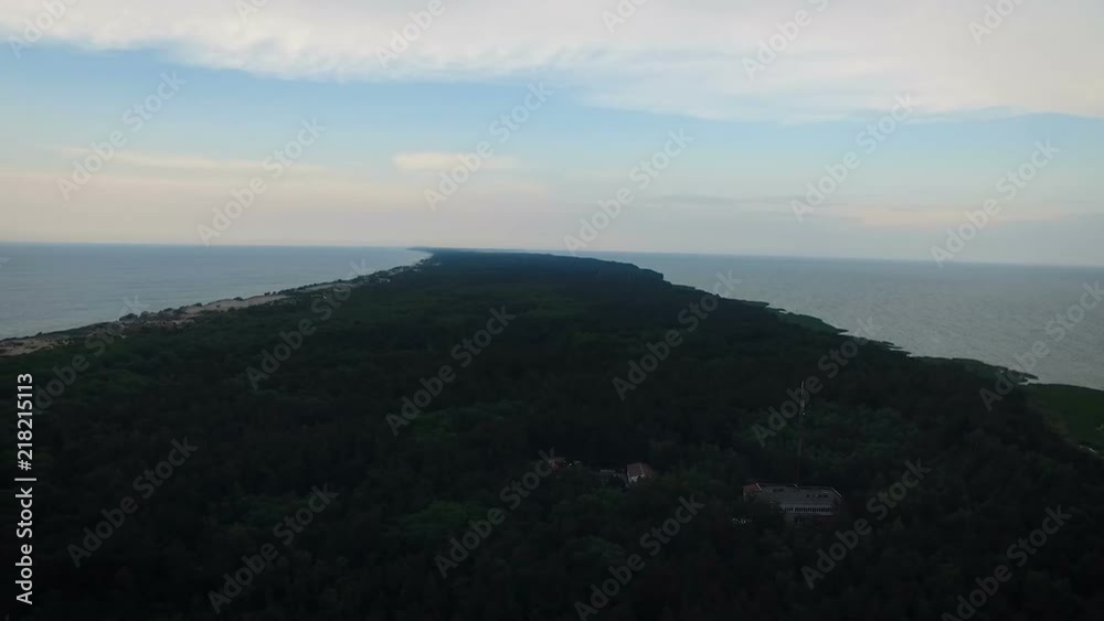 Panoramic shooting of the peninsula with buildings. Woods and a sandy beach with barkhans aerial view. Panoramic shooting of the peninsula with buildings. Woods and a sandy beach with barkhans aerial view.